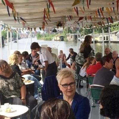 Different groups of people sitting on a boat