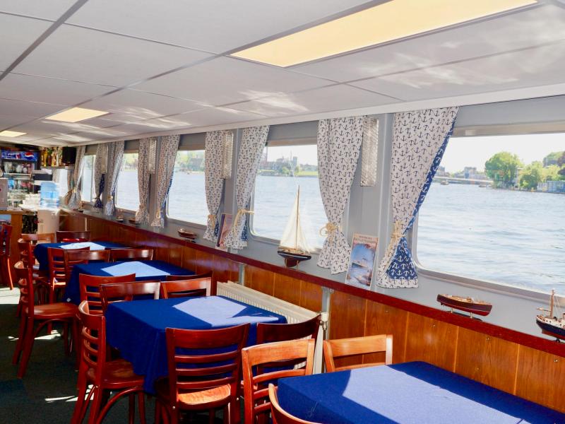 Chairs and tables on the inside of the boat