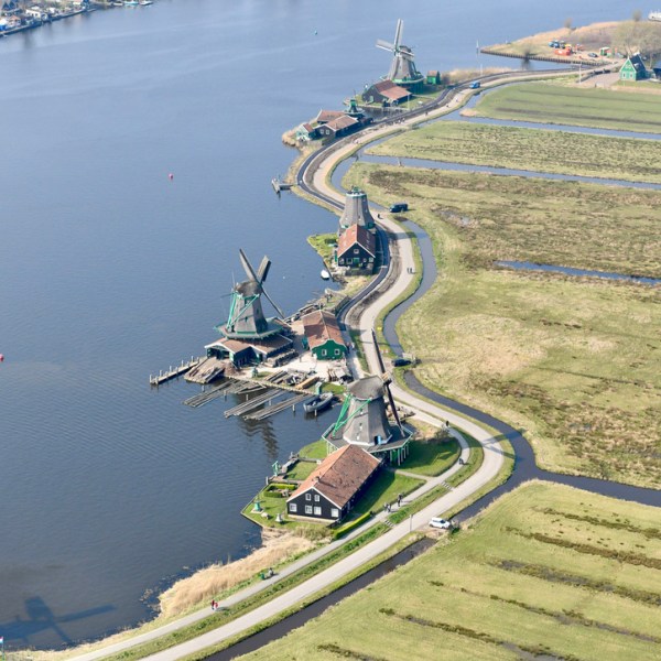 a body of water with a city in the background