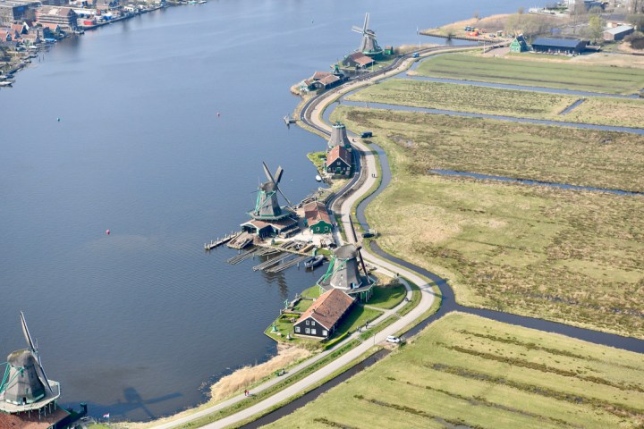 a body of water with a city in the background