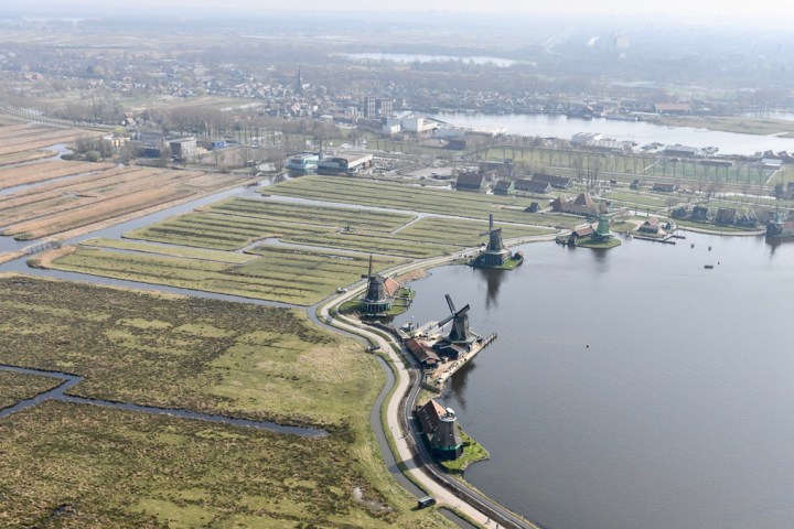 a large body of water with a city in the background