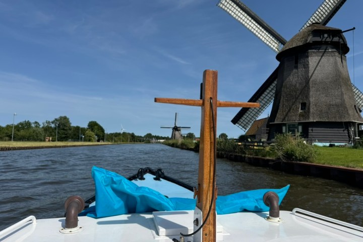 a wooden boat in a body of water